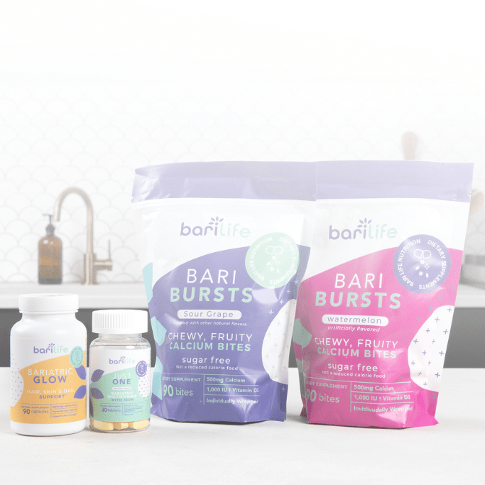 BariLife Bari Bursts sugar-free chewy calcium bites in grape and watermelon flavors with bariatric vitamins on a kitchen countertop.